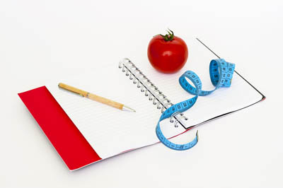 schrift, centimeter en tomaat